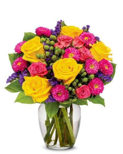 Gushing with vibrant colors, this unique flower arrangement resembles the morning sky. Bright Happy Bouquet is sure to bring any home or office to life with its hot pinks, sweet yellows, pretty purples and its generous cascade of greens. This noteworthy flower arrangement is becomes even more special during the spring and summer months, as weather compliments its warmth.